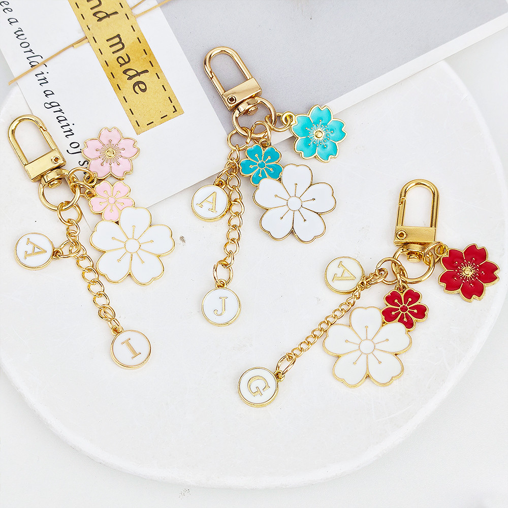 Creative เคลือบเชอร์รี่ดอกไม้พวงกุญแจโลหะหวาน Sakura ตัวอักษรจี้พวงกุญแจกระเป๋าเครื่องประดับ Charms ผู้ถือกุญแจรถของขวัญ
