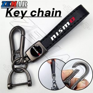 Nissan Nismo พวงกุญแจหนังโลหะ พวงกุญแจรถจักรยานยนต์ พวงกุญแจแขวนแฟชั่นระดับไฮเอนด์ รูปแบบการพิมพ์ Nissan Kicks Note Almera Terra Navara nismo xtrail March Teana Leaf Juke Sylphy