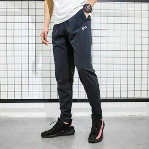 ฤดูใบไม้ผลิและฤดูร้อนผู้ชายกางเกงตรงหลวมสบายๆเอวยางยืดกางเกงกีฬา