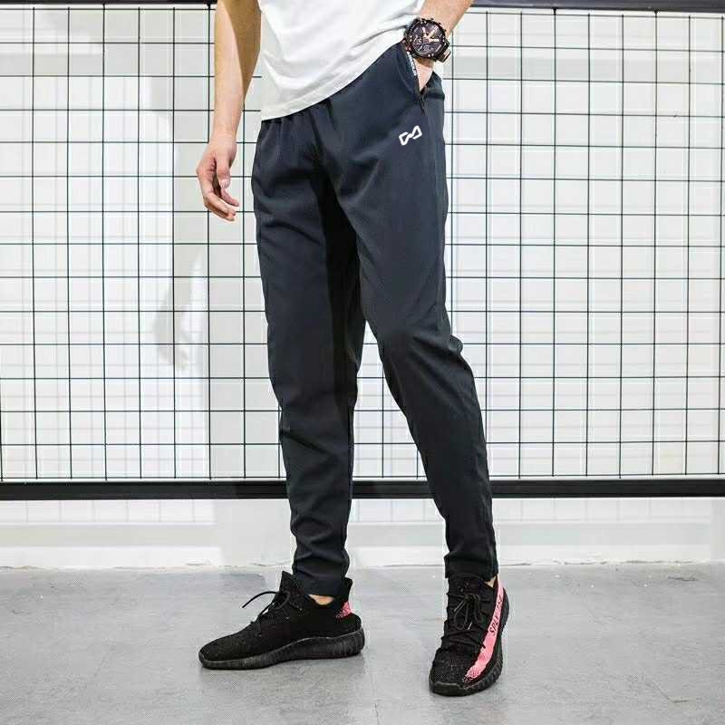 ฤดูใบไม้ผลิและฤดูร้อนผู้ชายกางเกงตรงหลวมสบายๆเอวยางยืดกางเกงกีฬา