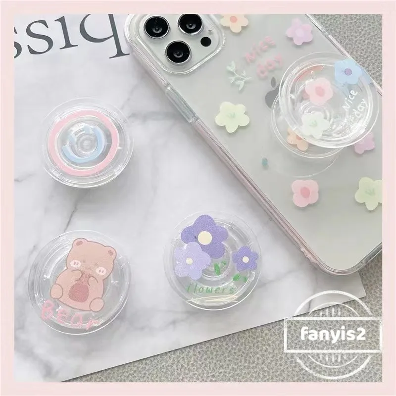 ตัวยึดถุงลมนิรภัย แบบใส ลายการ์ตูนดอกไม้น่ารัก เข้าได้กับเคสโทรศัพท์มือถือ สไตล์เท่ ยืดหดได้ พร้อมแหวนขาตั้ง